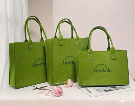 ins风新款手提毛毡包单肩收纳袋容量大质量...