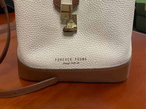 牛皮白色荔枝纹女士背包挎包，上班背，买菜背...