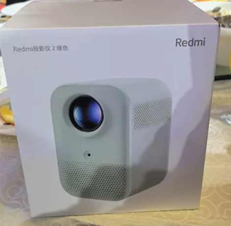 出Redmi投影仪2绿色，品牌为小米，是一...