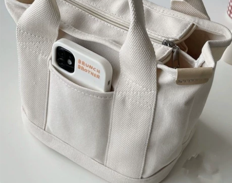 捡漏了，处理一批韩版帆布斜挎包大容量便当袋...