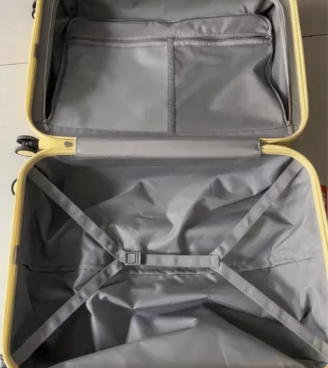 全新未使用过的米熙24寸宽拉杆云雀黄行李箱...