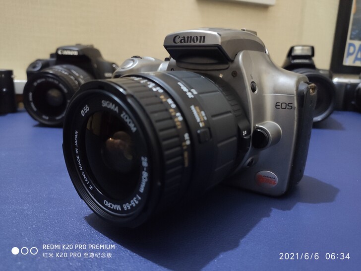 佳能eos单反相机+镜头，便宜处理。