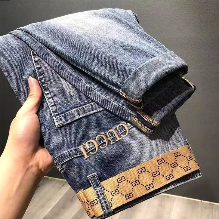 男士牛仔裤九分裤潮牌字母刺绣微哈伦修身小脚...