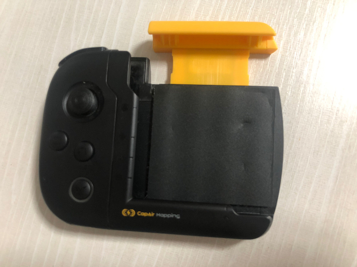 飞智黄蜂x游戏手柄,苹果x用的。买手机哥们...