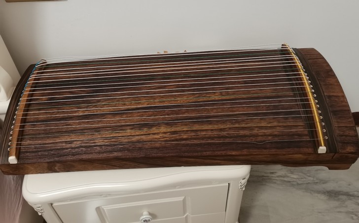 古筝转卖，弹了一次就没有弹过，一直放着，那...