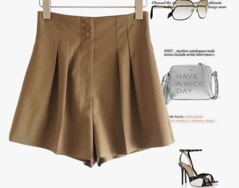 多了一点女人味！卡其色腰间钉扣高腰压褶短裤...