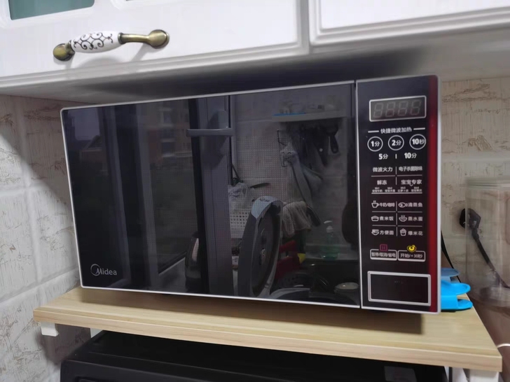 【品牌型号 美的M1-L202B智能平板式】