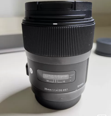 适马35 1.4佳能口镜头，成色如图，京东...