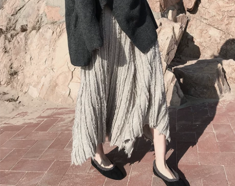 秋季不规则裙子中长款流苏重工复古高腰显瘦半...