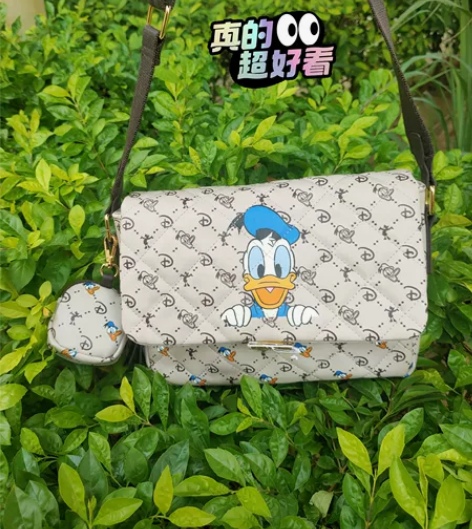 太好看了!唐老鸭单肩斜挎包印花可爱创意女包...