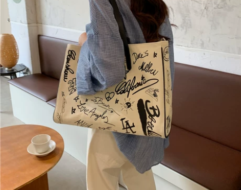 涂鸦帆布包包女2022新款大容量手提托特包...