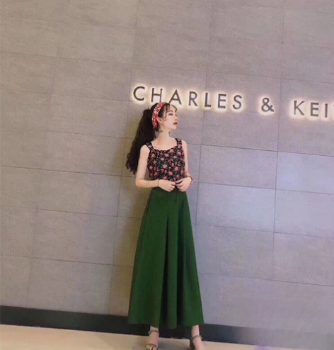 朝花夕拾朝花惜拾绿色半身A字裙，经典款！吊...