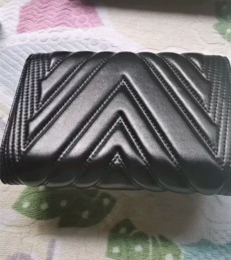 m.c.m家小羊皮手拿链条包 衍缝设计 M...