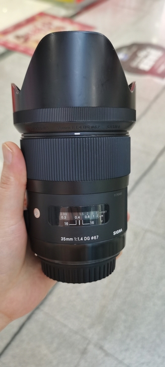 出一支成色不错的适马35/1.4,佳能口,...