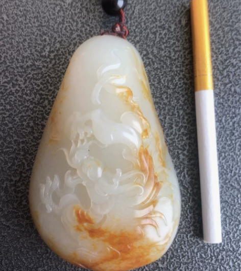 和田玉籽料手把件，该手把件是海派玉雕大师张...