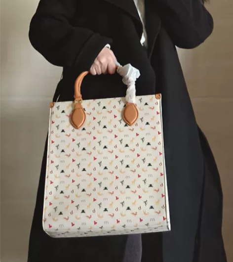 不莱玫棕色花花涂鸦款特包手提包单肩包大容量...