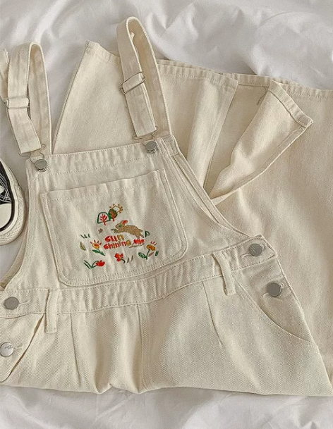 背带裙 短裙背带元气减龄刺绣图案纯色牛仔女...