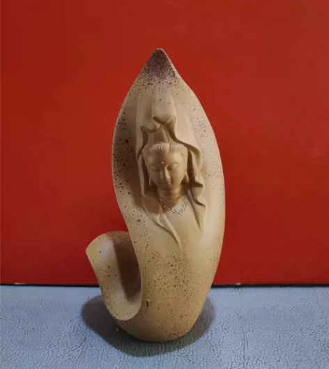 紫砂观音摆件。那年，我和明友去北京举办的茶...