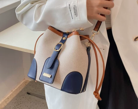 高级感帆布撞色斜挎水桶包包女秋冬2022新...