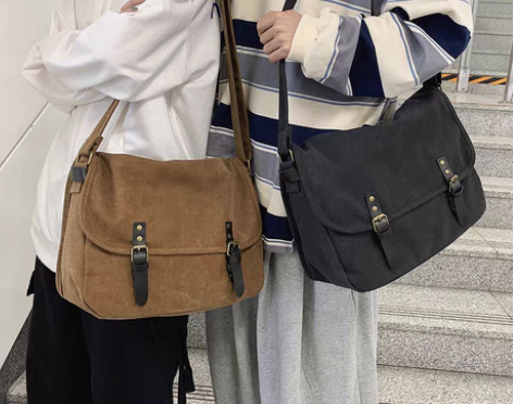 包邮潮牌日系ins风单肩包大容量男斜挎包学...