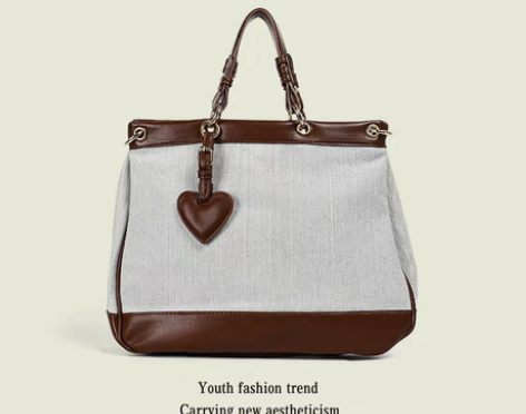 转卖优尚女包2022春夏新品爱心牛仔帆布棋...