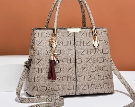 全新袋鼠正品真皮女包2021秋冬新款印花时...